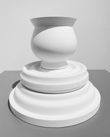 Plaster prototype of stacked dinnerware shapes.
